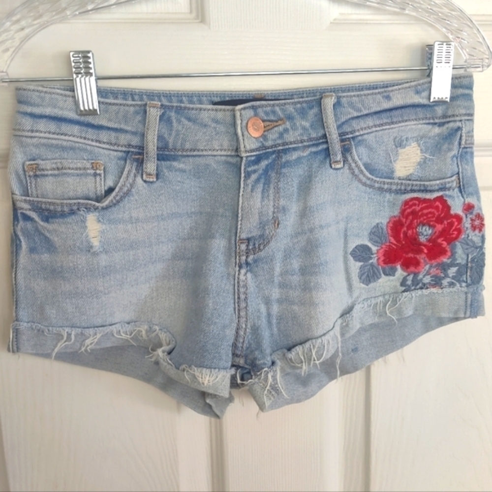 Hollister jeans shorts with floral design.